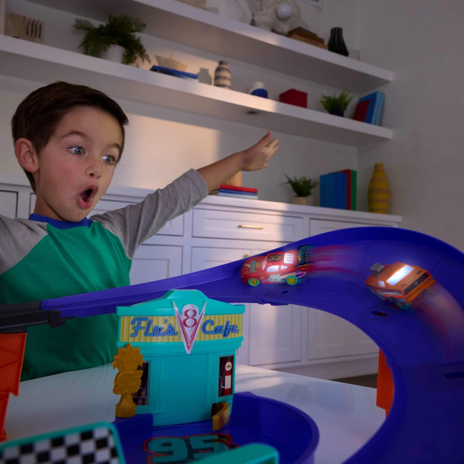 Pixar Cars Track Set with Light-Up Lightning McQueen, Race to Celebrate Celebration Raceway