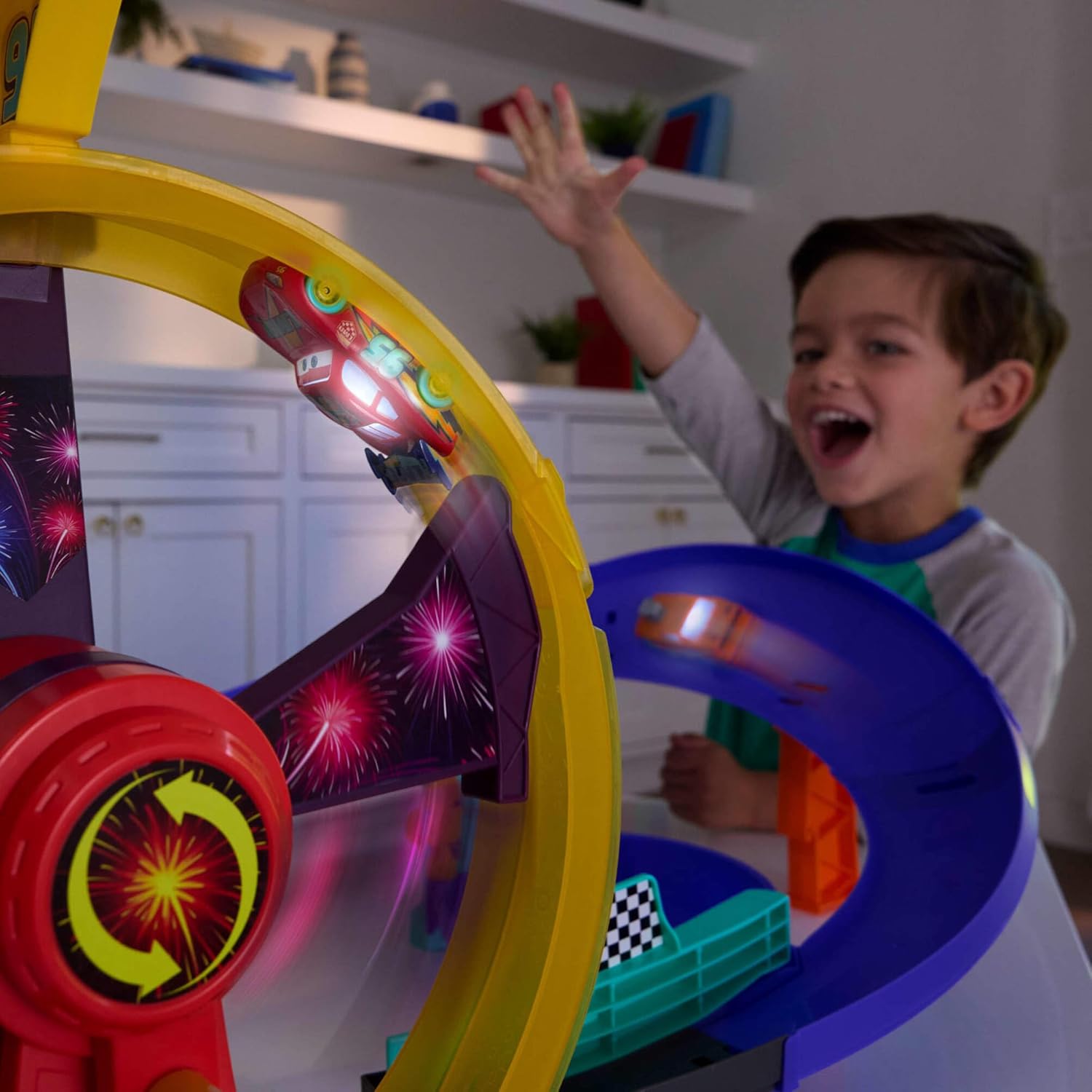 Pixar Cars Track Set with Light-Up Lightning McQueen, Race to Celebrate Celebration Raceway